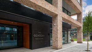 The Benson Building with a modern brick facade, large glass windows, and a visible entrance. - The Benson Two by Dublin At Home (Dublin)