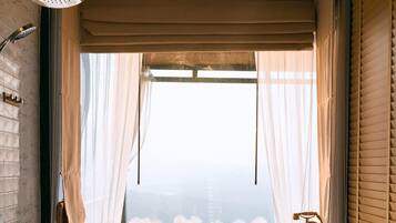 Villa | Bathroom | Combined shower/bathtub, bathrobes, towels