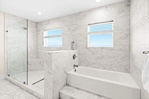 Shower, hair dryer, towels, shampoo