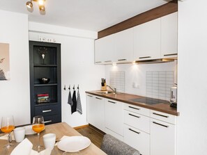 Fridge, stovetop, dishwasher, coffee/tea maker