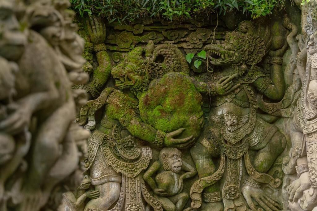 A detailed stone carving with intricate designs and figures.