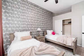 A bedroom with two beds, a wardrobe, and a nightstand with a lamp. - NEW! Luxury, Scottsdale Getaway! (Scottsdale)