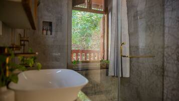 Designer toiletries, hair dryer, slippers, towels