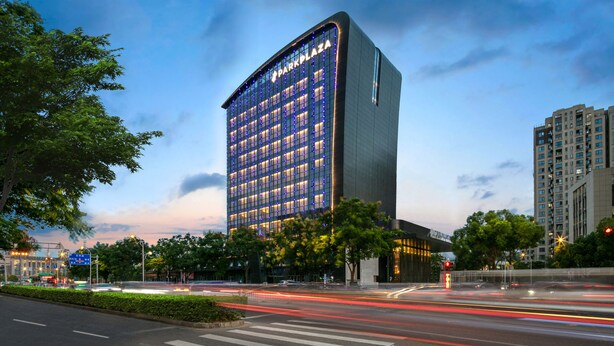 A modern hotel with a prominent 'Park Plaza' sign, featuring a grid of windows and a flat roofline. - Park Plaza Wenzhou (Wenzhou)