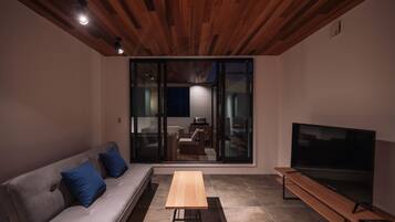 Deluxe Villa | Living area | 55-inch LCD TV with digital channels