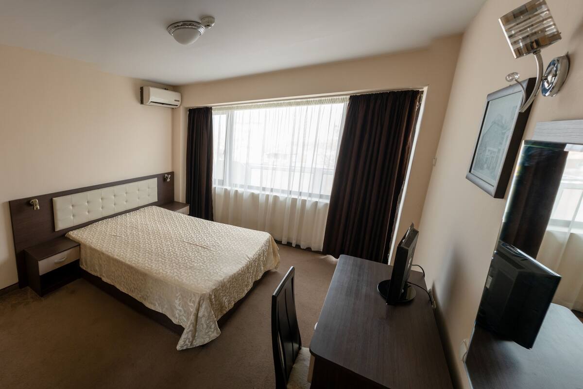 Basic Room | Desk, laptop workspace, blackout drapes, iron/ironing board (on request)