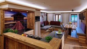 A modern interior with a wooden accent wall, a cozy seating area, and a dining space. - Ferienwohnung Bootshütte, 1-5pers., 2sep. SZ, 2.og, Balkon mit Chiemseeblick (Chieming)