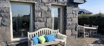 Detached cottage overlooking lake in Connemara