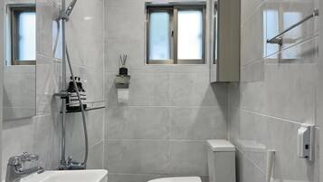 Shower, hair dryer, towels, soap