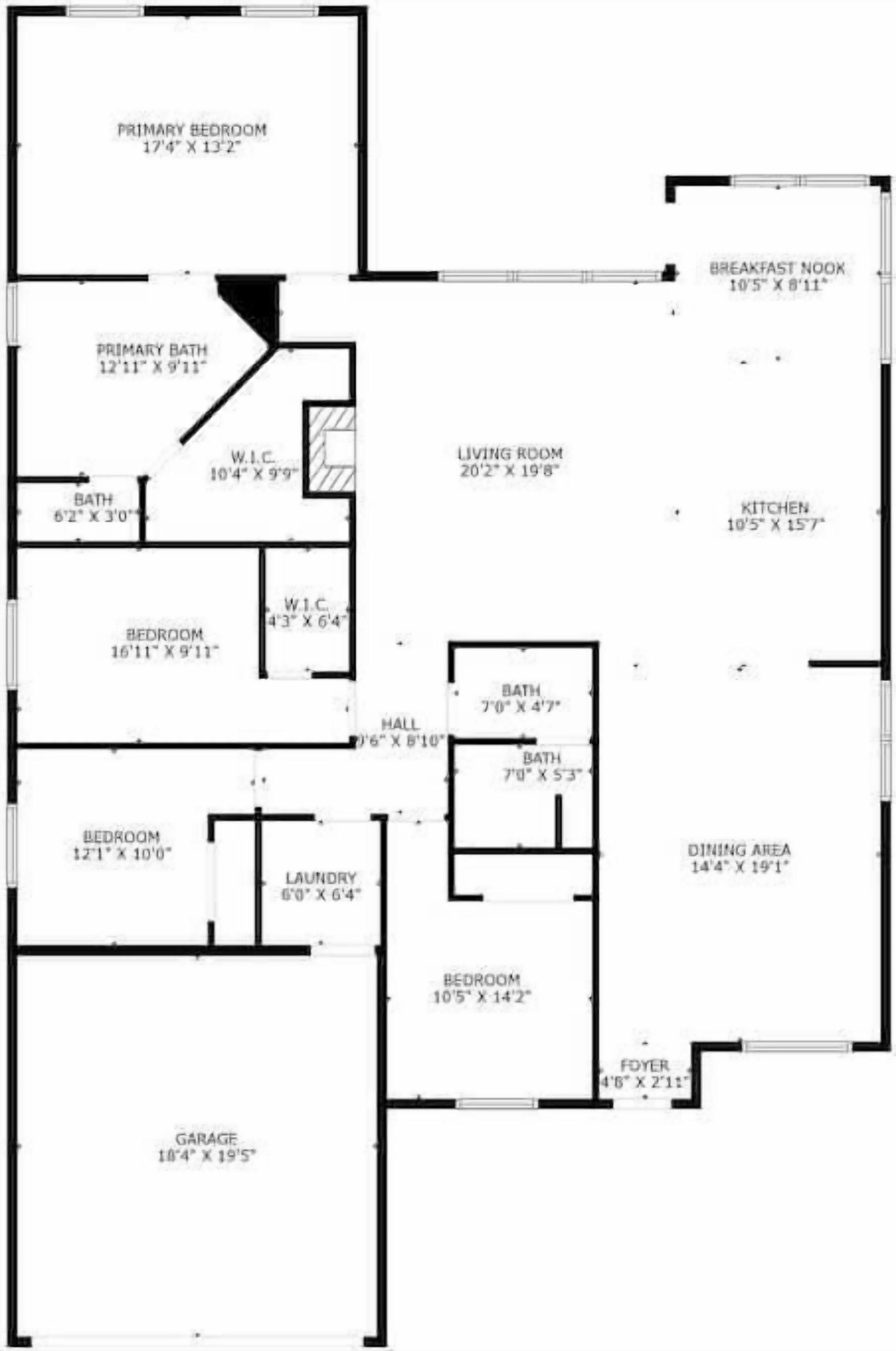 A floor plan with a primary bedroom, living room, kitchen, dining area, and garage.