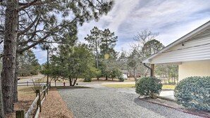 A gravel driveway leading to a house with a covered porch, surrounded by trees and a fire hydrant. - Studio w/ Patio - Walk to Hikes, Sights & Bites (Aberdeen)