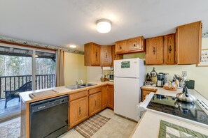 Enjoy cooking in this well-equipped kitchen with a stovetop, oven, and dishwasher.