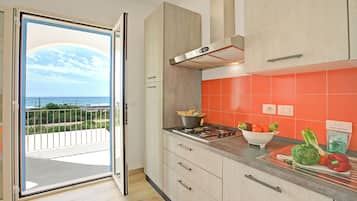 Standard Apartment, 2 Bedrooms (La Primula Apartment 2 Sea View) | Private kitchen | Fridge, oven, stovetop, coffee/tea maker