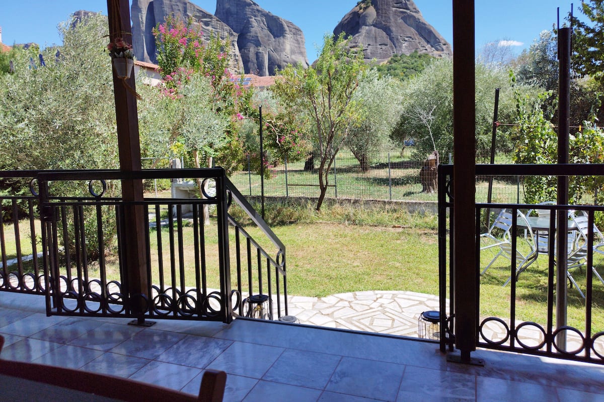 A patio with a view of rocky mountains.