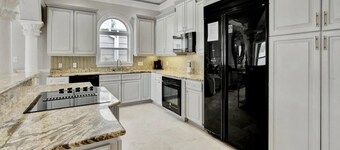 Family fun by the beach! 5500 sq ft with 5 BRs, 5 baths, game room, heated pool