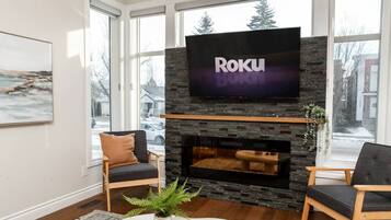 Smart TV, fireplace, books, offices