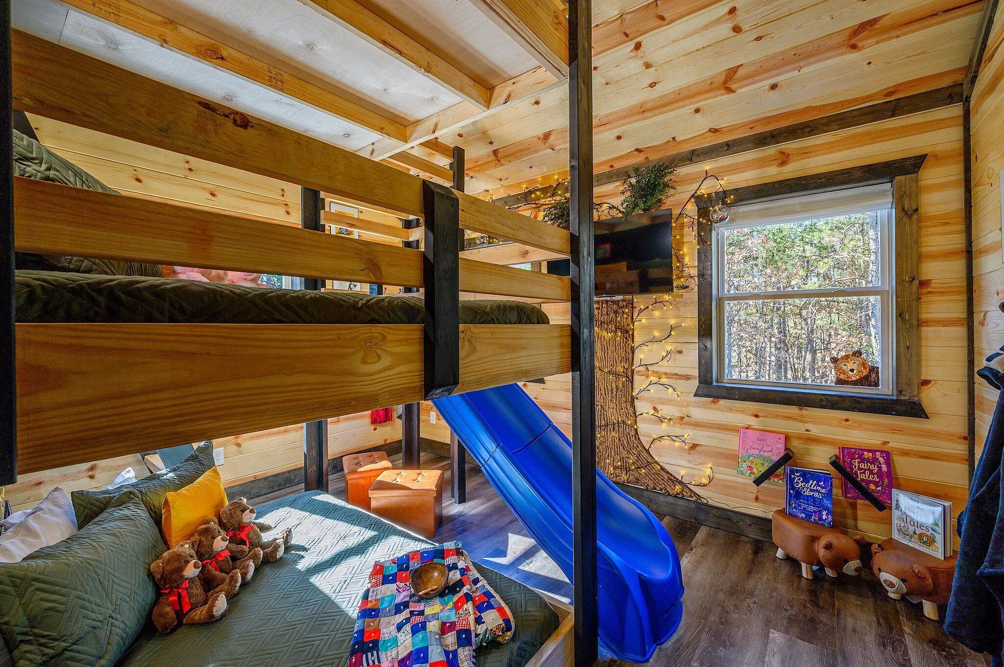 A playful bunk room where kids can slide, sleep, and enjoy their own space.
