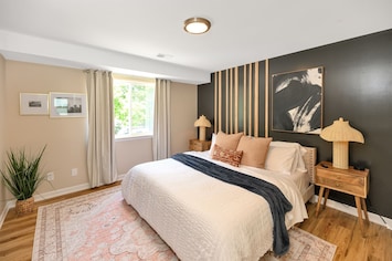 Experience the luxurious comfort of our king-size bed adorned with opulent linens and plush pillows.