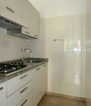 Fridge, coffee/tea maker, cookware/dishes/utensils