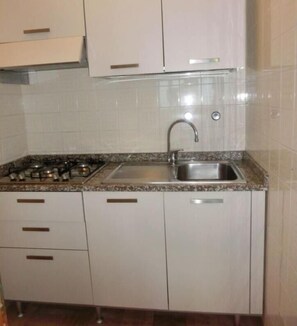 Fridge, coffee/tea maker, cookware/dishes/utensils