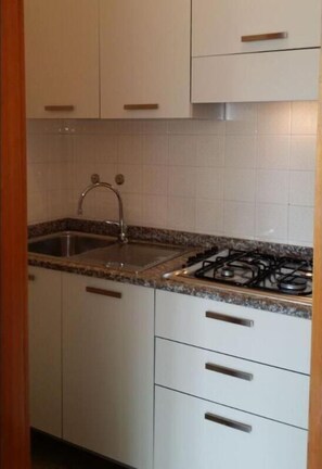 Fridge, coffee/tea maker, cookware/dishes/utensils