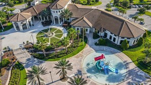 An aerial view of a resort with a central courtyard, a water park, and surrounding greenery. - Last Minute Disney Getaway! Townhouse with Private Pool. Book Now! #87939 (Orlando)