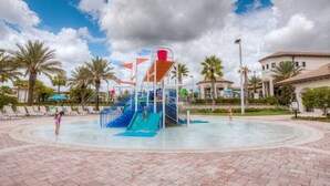 A water park with a blue slide and a red water feature.