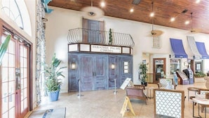 A spacious lobby with a balcony, a cinema named 'Paradise Palms Cinema', and various seating areas. - Last Minute Disney Getaway! Private Pool, Hot Tub & Game Room. Book Now! #82571 (Orlando)