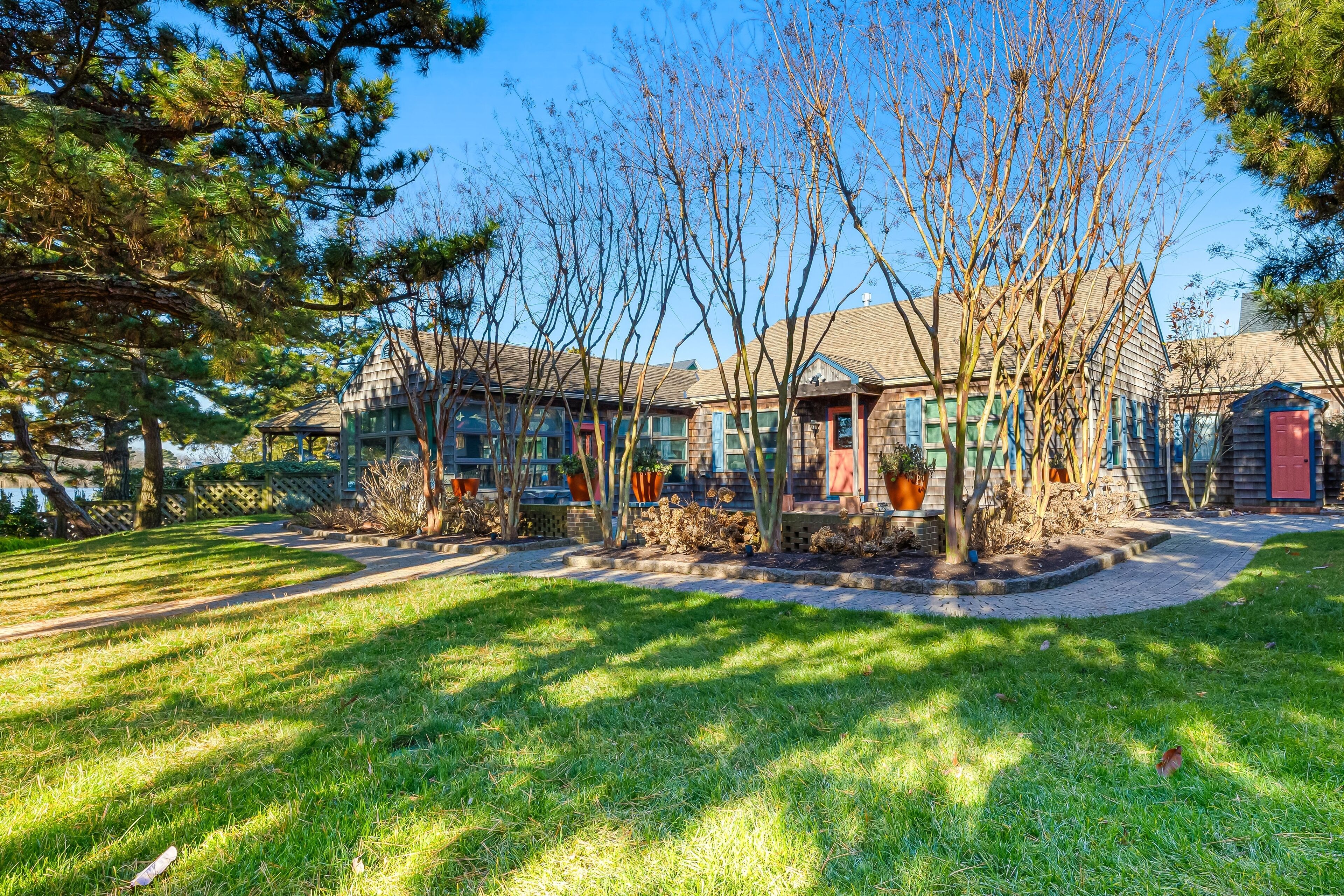 Town of Rehoboth Beach lakefront home with private pool & beach access