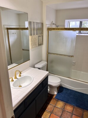 A bathroom with a white sink, gold faucets, a toilet, and a glass-enclosed shower. - West Hollywood, Hollywood Hills, Sunset Strip House with Beautiful Views (Beverly Hills)
