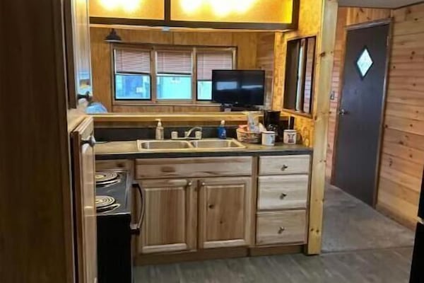 Full kitchen, awesome cabinets, full stove and refrigerator.