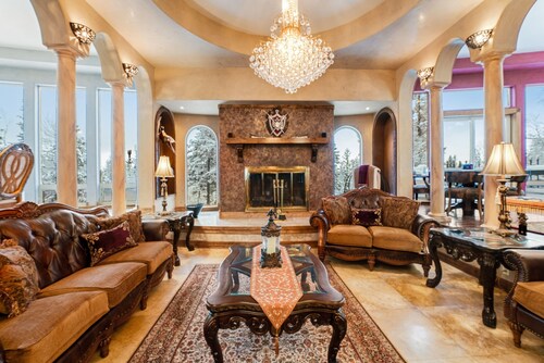 Whimsical acreage with high-end finishes, old-world character, air hockey, & W/D