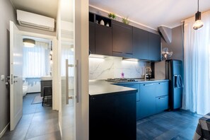 Private kitchen - GuestHost - Comfortable apartment located on the second floor of a building without lift.In 60 m2 of space it comfortably accommodates two people, with one bedroom.There are internal stairs that are NOT accessible.Small building with a green space and am (Parma)