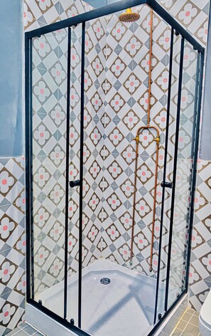 Shower, towels, soap, toilet paper