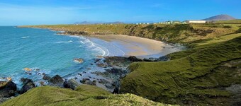 Escape to our charming stone cottage in South Wales, a rustic retreat perfect for couples. Enjoy a cozy stay with a stone fireplace, a king-sized bed, and a private, enclosed garden perfect for pets. Conveniently located near Bridgend and  Porthcawl.