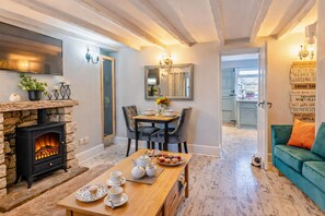 Interior - Escape to our charming stone cottage in South Wales, a rustic retreat perfect for couples. Enjoy a cozy stay with a stone fireplace, a king-sized bed, and a private, enclosed garden perfect for pets. Conveniently located near Bridgend and  Porthcawl. (Bridgend)