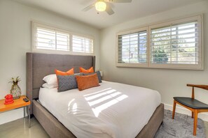 Relax in this inviting bedroom with a large bed and comfortable seating area.