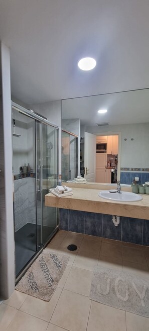 Shower, hair dryer, towels, soap