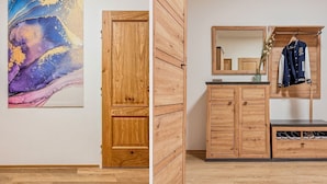 A room with a wooden wardrobe, a mirror, and a coat rack. - Central Cozy & Charming Residence 3min from Riverside Prague (Hlavní mesto Praha)