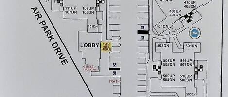 A Pacific Plaza Resort Sitemap with Pier Avenue, air park drive, lobby, guest laundry, and various room numbers.