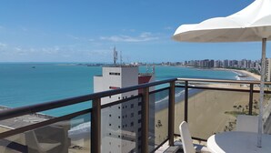 A balcony with a view of a beach and a cityscape. - Atlantic Ocean by SOLEMAR (Fortaleza)