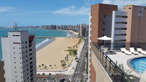 A high-rise building with a view of a beach and ocean. - Atlantic Ocean by SOLEMAR (Fortaleza)