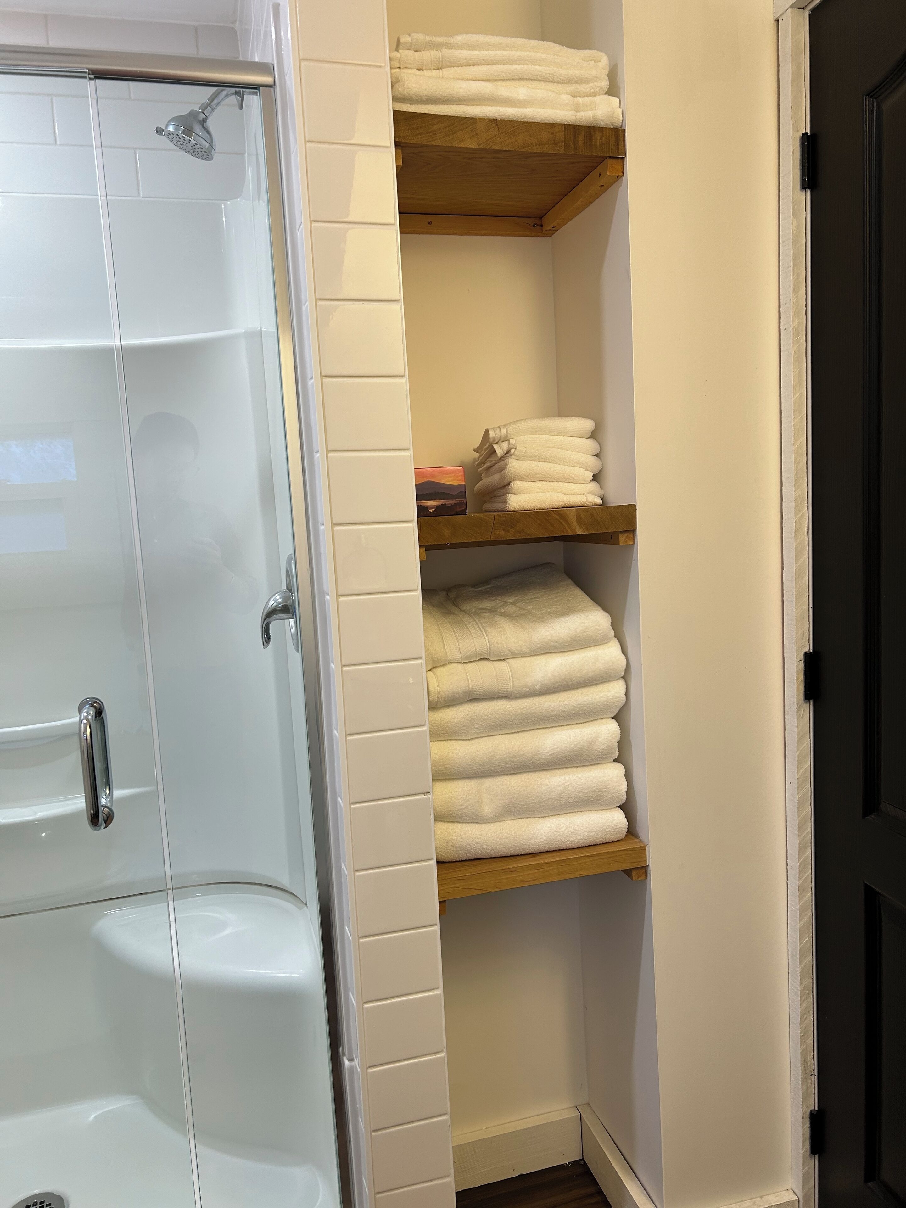 Shower, towels, soap, toilet paper