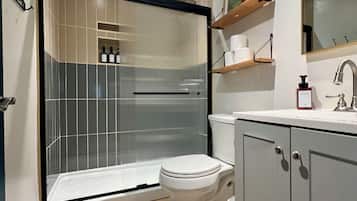 Shower, hair dryer, towels, soap