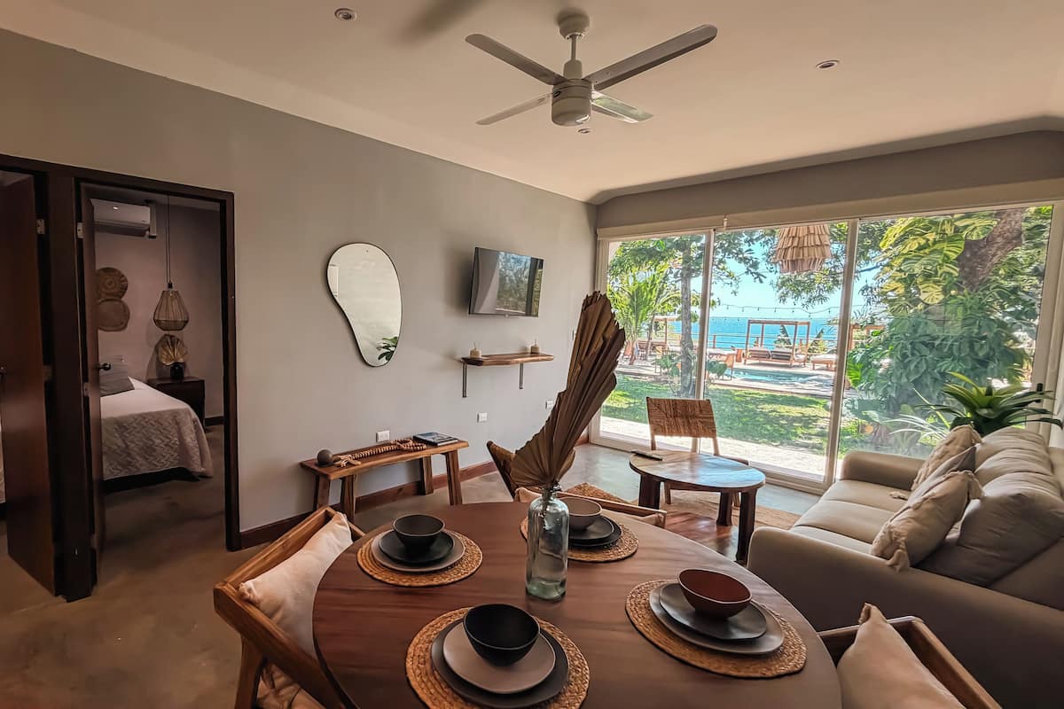 Deluxe Apartment, 2 Bedrooms, Sea View | Living area | 32-inch Smart TV with digital channels