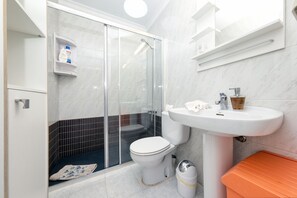 Shower, hair dryer, towels, soap