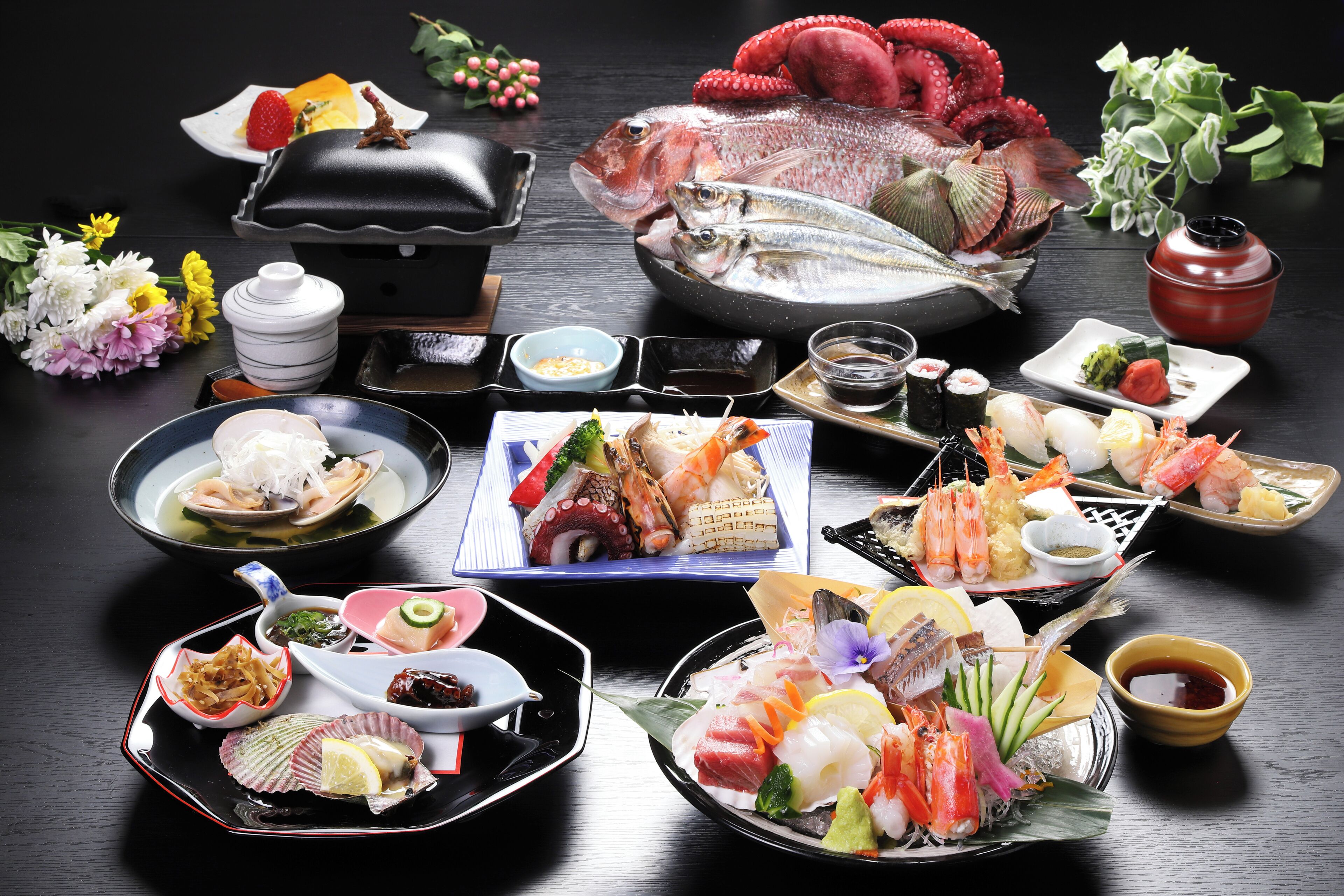 A variety of seafood dishes arranged on a table.
