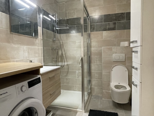 Shower, hair dryer, towels, soap