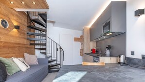A modern kitchen with a built-in oven, a coffee maker, and a kettle on the counter. - Modern duplex 2/3 rooms, 6 ppl, sheets incl, Avoriaz (Avoriaz)
