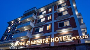 A multi-story hotel with illuminated signage reading "FIVE ELEMENTS HOTEL PVT. LTD." - Lumbini Five Elements Hotel (Lumbini)